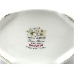 Royal Albert Haworth pattern tea and dinner wares, comprising eight dinner plates, ten salad plates, fourteen side plates, eight bowls, sauce boat and stand, pair of cruets, six tea cups and six saucers, cream jug, open sucrier, and cake plate. 