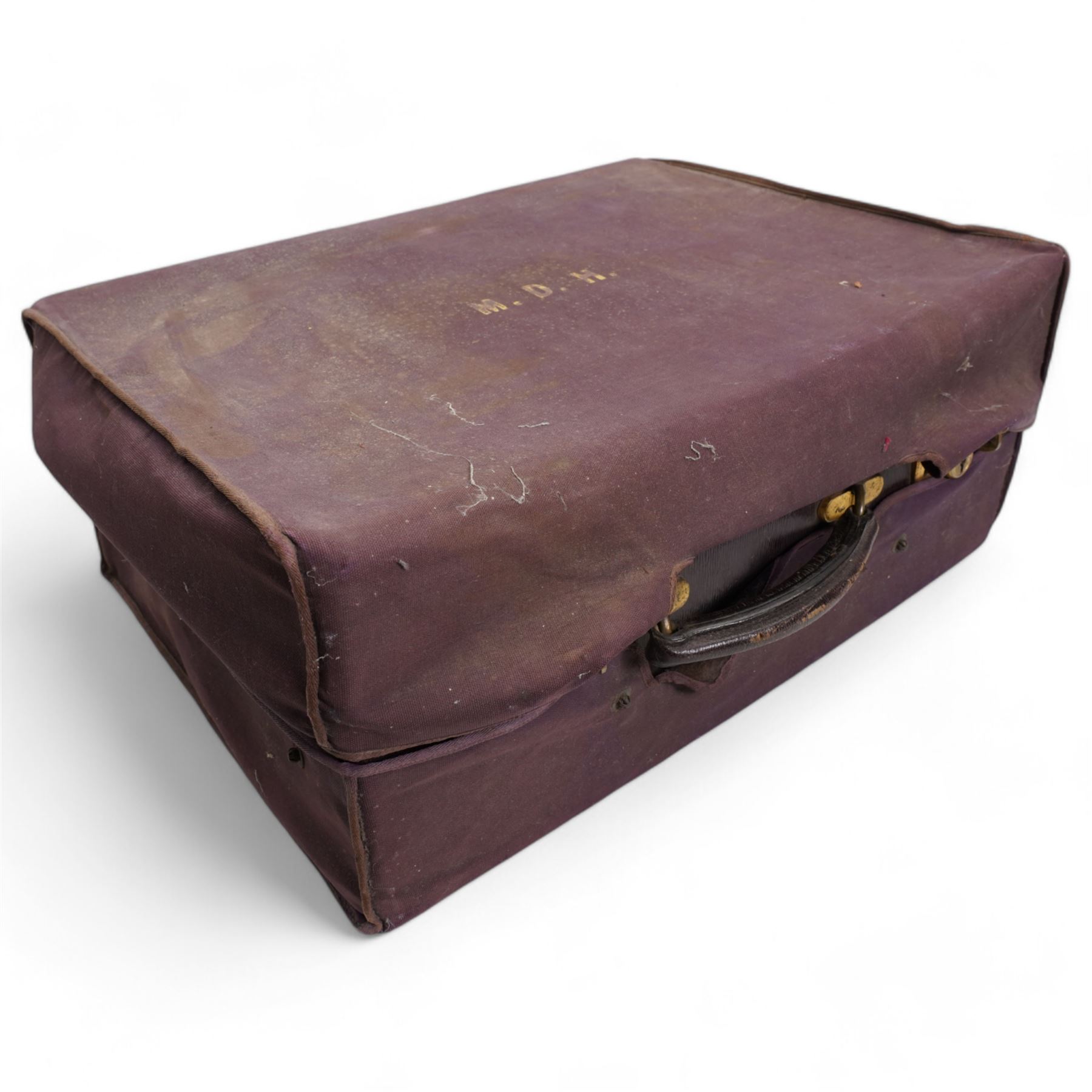 Ladies leather travelling dressing case, the watered silk interior with silver mounted glass bottles, silver backed brushes, folding leather writing case, sewing case, ink well etc, the silver hallmarked for Sheffield 1918, Maker Walker & Hall 50cm x 36cm in outer canvas case