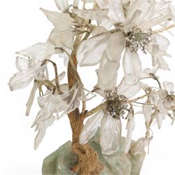 Early 20th century Chinese carved fluorite and crystal table lamp, depicting a blossoming tree on a rocky outcrop, on a carved hardwood stand inset with a bulb, H40cm