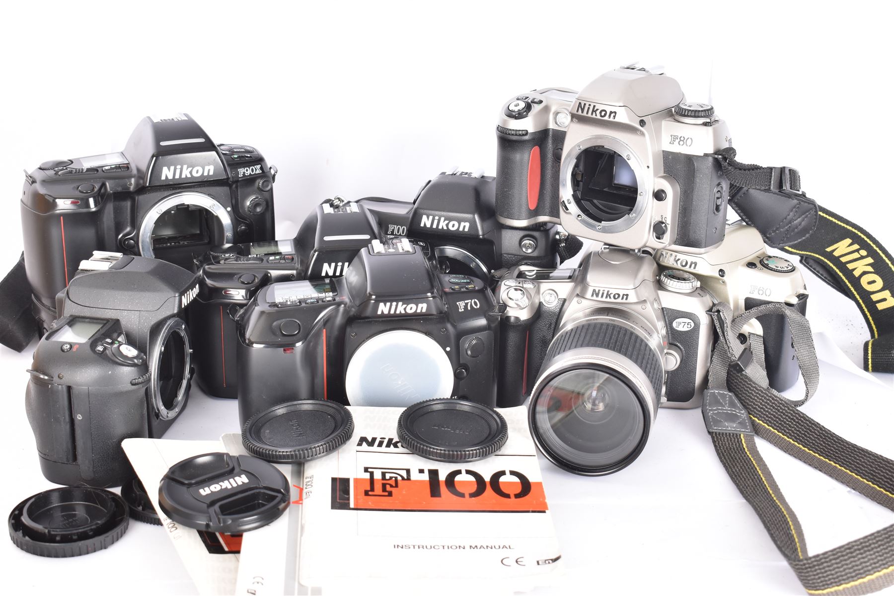 Collection of Nikon cameras, to include F60 serial no. 2574507, boxed, F70 serial no. 2807667, F75 serial no. 2062602, with an AF Nikkor 28-100mm 1:3.5-5.6 G lens serial no. 2166614, two F80 examples serial nos. 2553343 & 2777869, two F90X examples serial nos. 2209737 & 2438888, one boxed and an F100 serial no. 2051550