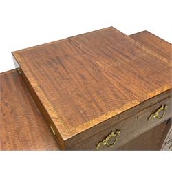 Late 19th century mahogany and satinwood dressing chest, the raised middle section hinges to reveal an interior fitted with lidded compartments, removable tray, single drawer and glass scent bottles, lift-up bevelled mirror with adjustable hinged mechanism, fitted with a further eight cock-beaded graduating drawers and curved kneehole with double cupboard, square tapering supports on brass cups and castors, inlaid throughout with checkered stringing, ornate Rococo cast gilt metal handles