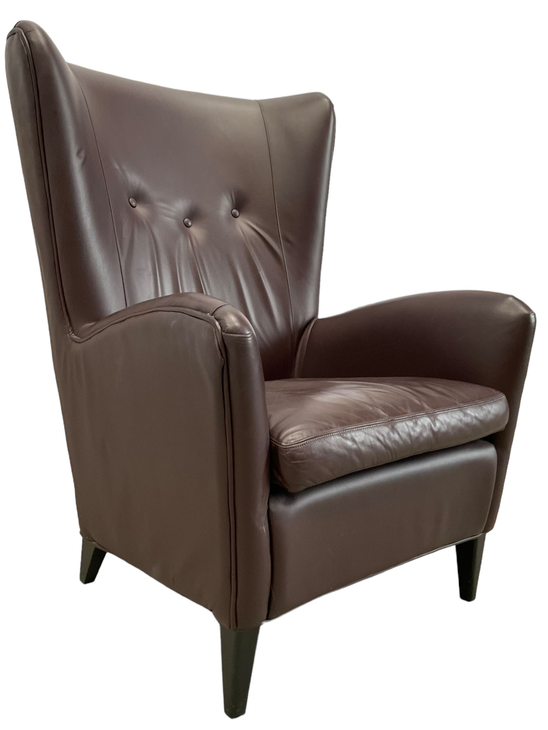 Wing back armchair upholstered in cocoa brown leather