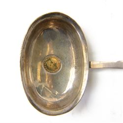 George III silver toddy ladle, the oval bowl set with a King George III 1802 gold one third of a guinea coin, with baleen twist handle, L40cm