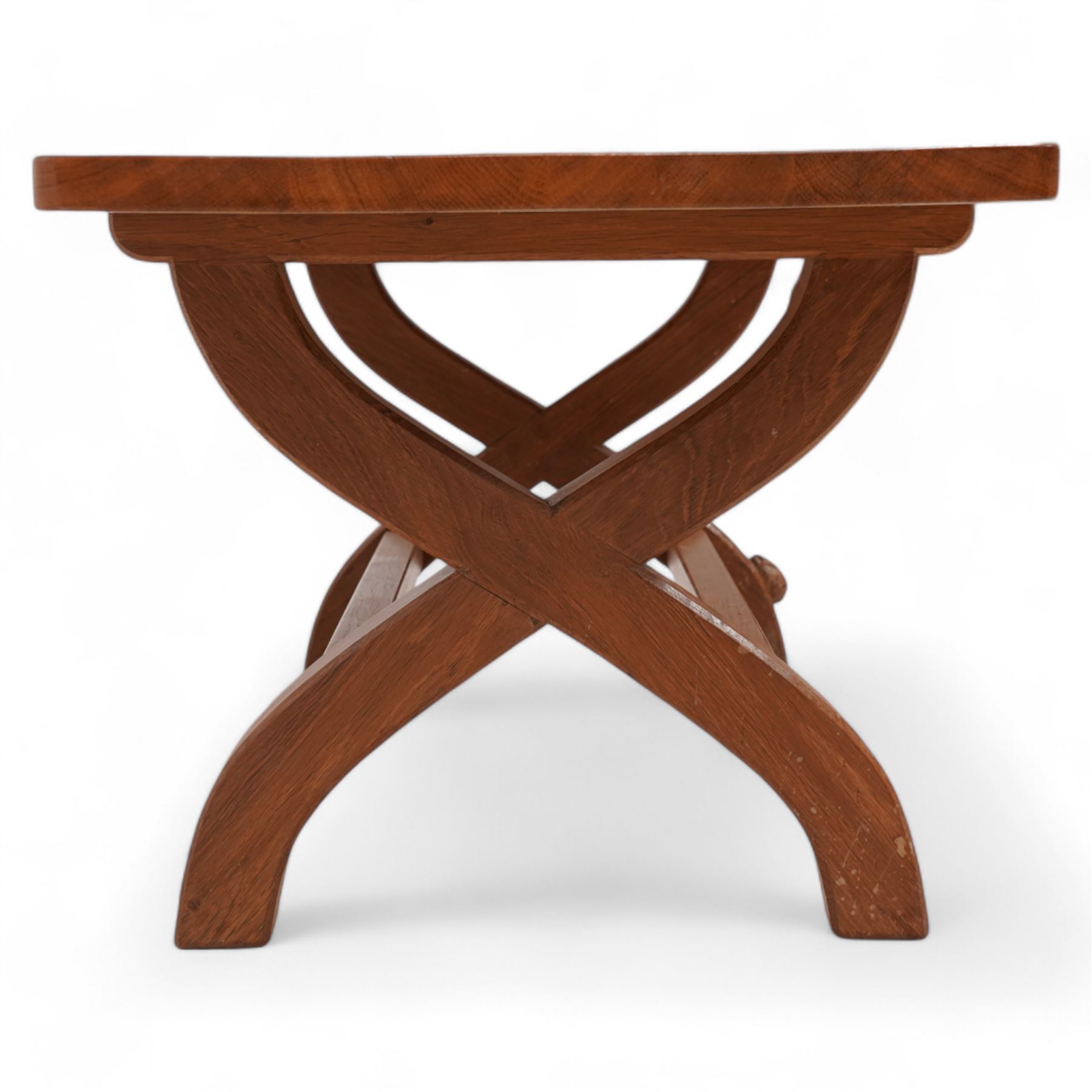 Rabbitman - oak coffee table, rectangular adzed top on curved x-framed supports, carved with rabbit signature, by Peter Heap, Wetwang