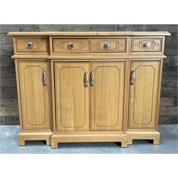 Light oak breakfront sideboard dresser, fitted with four drawers and four cupboards