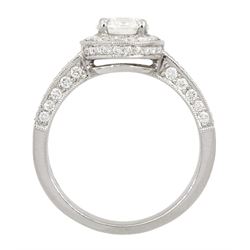 Platinum single stone round brilliant cut diamond ring, with pave set diamond surround, gallery and shoulders, principal diamond approx 0.90 carat, with platinum diamond set band, both hallmarked