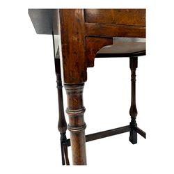 Early 20th century oak walnut lamp or side table, rectangular top with red leather insert, over single drawer with felt lining and brass handle, raised on turned supports with stretchers