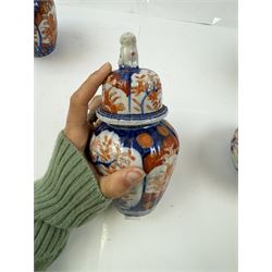 Three pairs of Imari vases, including a pair of baluster form with covers with foo dog finials, tallest H21cm 