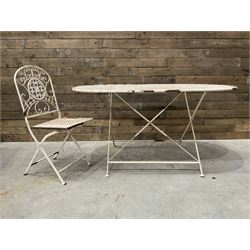 Wrought metal oval garden table and folding chair