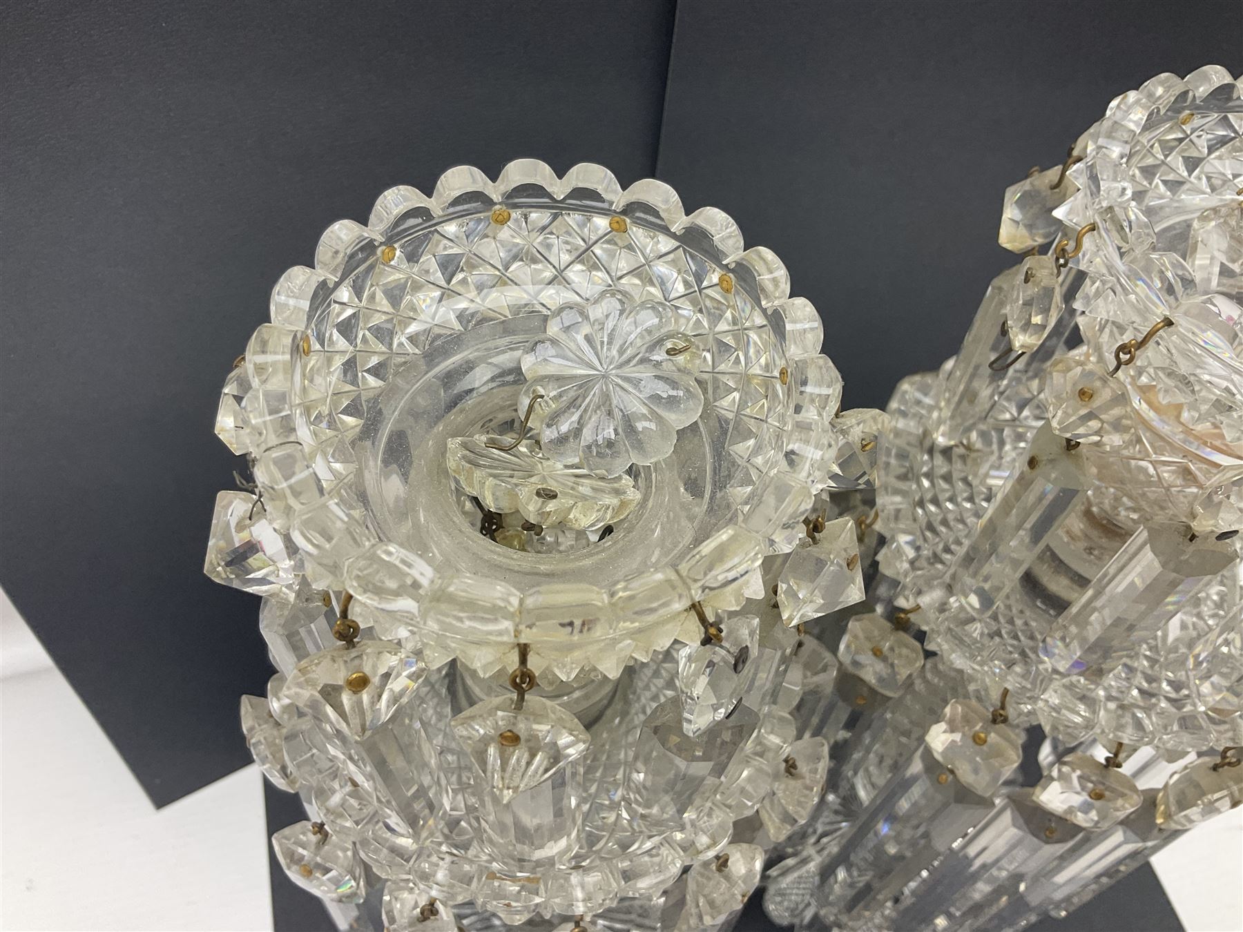 Pair of Victorian clear glass lustres, each with two tiered cut glass bowls supporting cut clear glass lustre drops upon central hobnail cut stem, H29cm