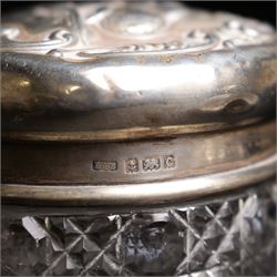 Silver navette shape bread basket with pierced sides, L28cm Chester 1900 Maker William Aitken, globe scent bottle with silver cover, glass dressing table jar with silver lid and a silver backed hairbrush 