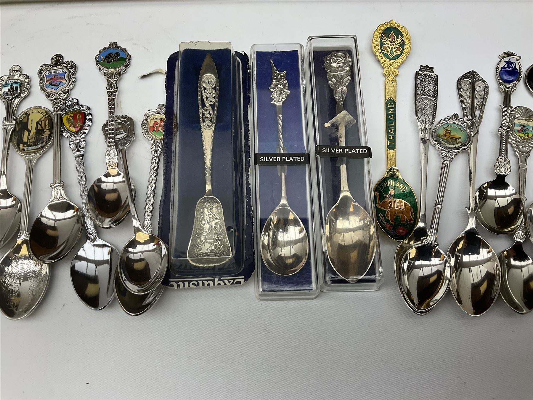 Collection of souvenir teaspoons with wooden display case, H62cm, L53cm. 