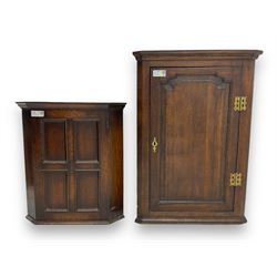 Early 20th century wall mounted oak corner cabinet, moulded cornice over panelled door enc...