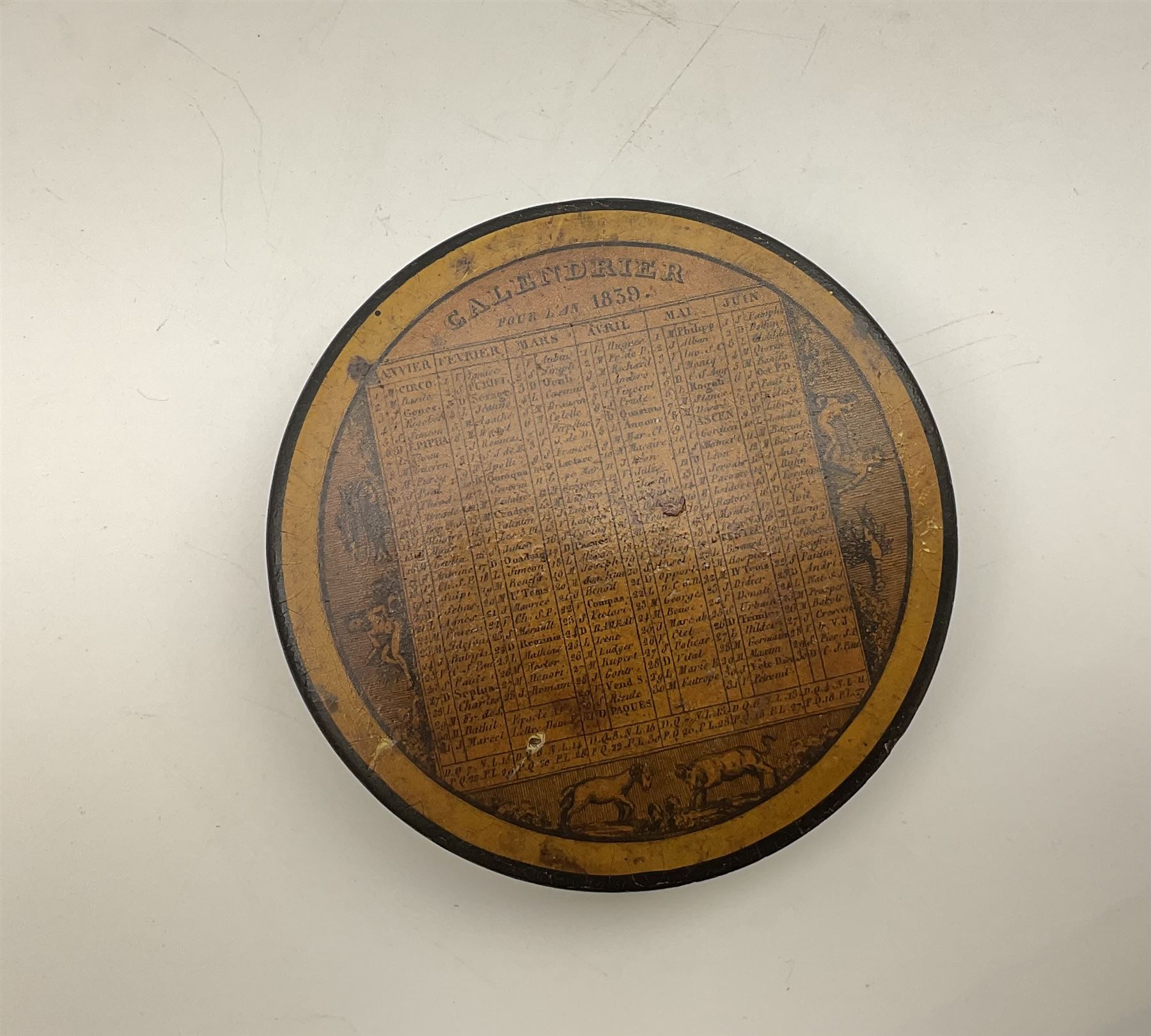 Two 19th century French papier-mâché snuff boxes, each of circular form decorated with the French calendar and detailed 'Calendrier pour l'an 1839' and 'Calendrier pour l'annee 1844' to top and ''Saisons' to base, further detailed with the months, days and additional notations alongside symbols from the zodiac, larger example D9.5cm, smaller example D8.5cm