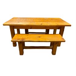 Pine dining table, rectangular plank top on square supports (181cm x 91cm, H80cm); together with two benches (133cmx 41cm, H47cm)