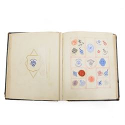 Victorian album of crests and monograms, including examples cut from envelopes and stamped...