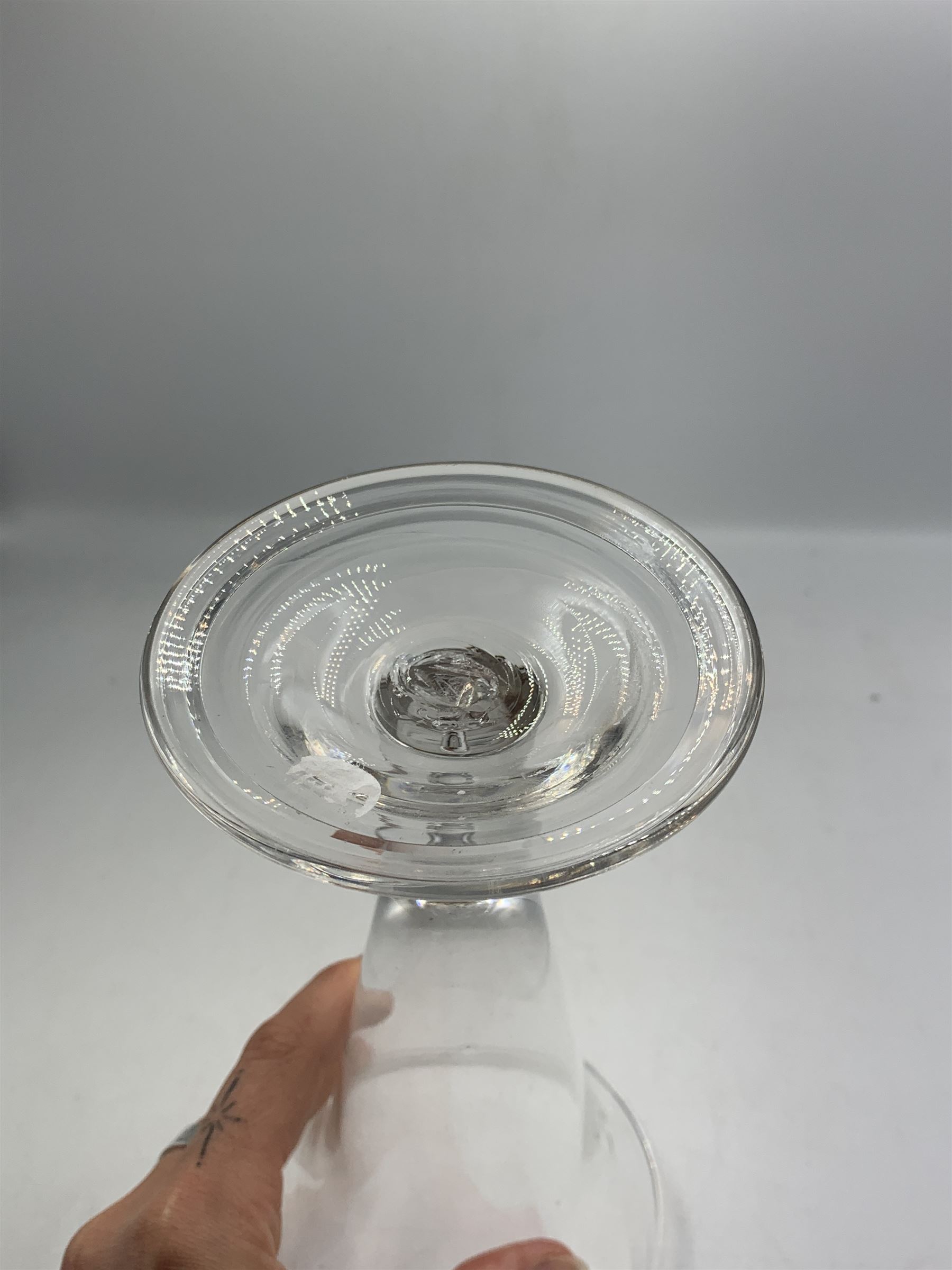 Large 18th century ale glass, circa 1780, with drawn trumpet bowl and flared rim, teardrop stem on a domed folded foot, H20cm