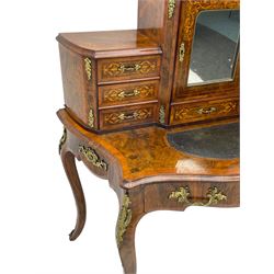 19th century French figured walnut Bonheur de Jour or writing desk, the upper section with brass gallery over mirror glazed cupboard and a combination of drawers, shaped and moulded top with leather inset and satinwood band, fitted with single drawer, on cabriole supports, inlaid throughout with scrolling foliate decoration in boxwood, ornate cast brass mounts 