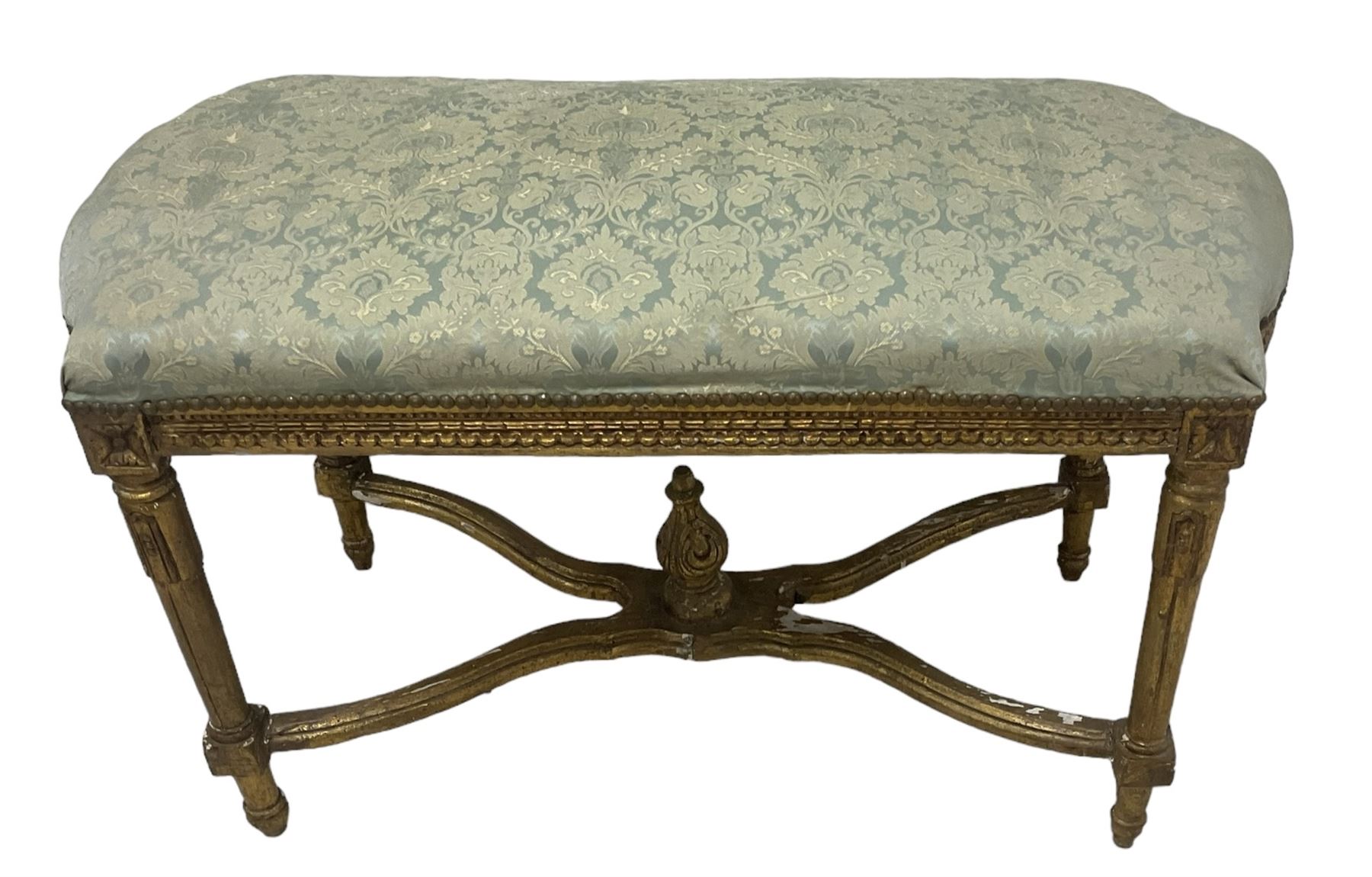 French Louis XIV design giltwood framed bench or window seat, sprung seat upholstered in pale blue foliate damask fabric with studwork border, raised on gesso moulded and carved tapering supports united by curved X-stretcher, with central acanthus carved finial