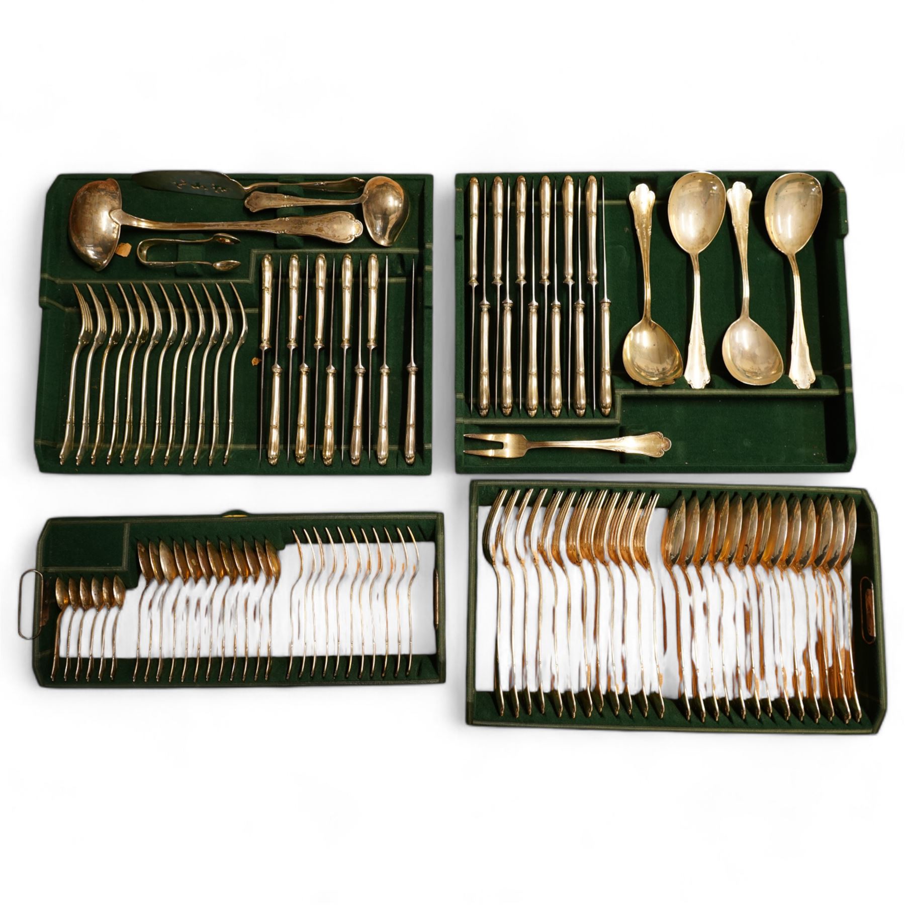 Suite of Austrian 800 standard silver cutlery with scroll pattern finials comprising twelve table forks, thirteen dessert spoons, twelve dessert forks, twelve silver handled table knives, eleven silver handled dessert knives, eleven pastry forks, twelve teaspoons and tongs, six coffee spoons, soup ladle, four serving spoons and fork, sauce ladle and pastry slice, Maker Alexander Sturm