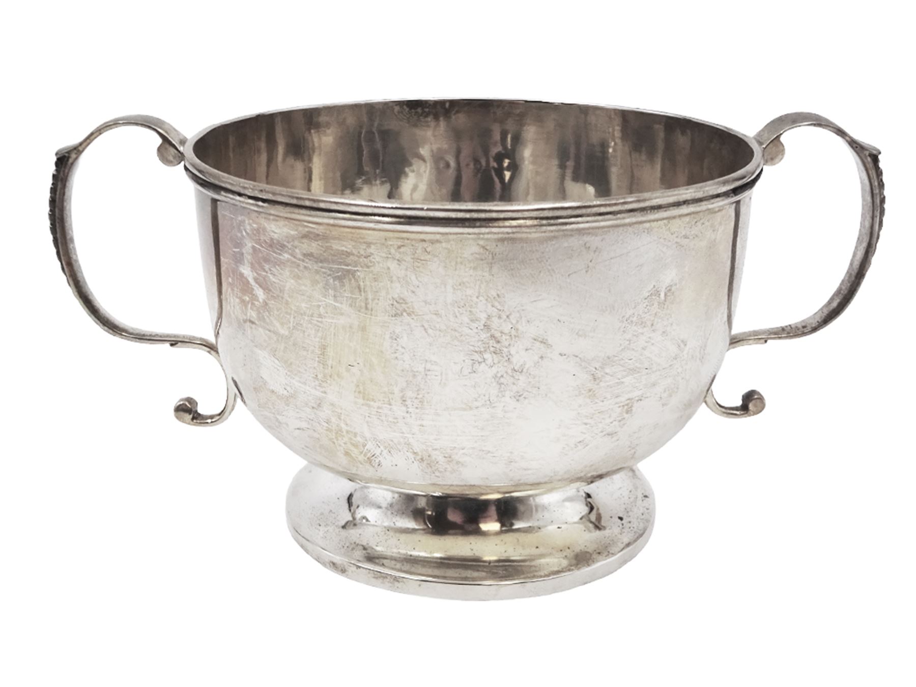 Late Victorian silver twin handled bowl, of plain circular form with two C scroll handles, upon a circular foot, hallmarked John Edward Wilmot, Birmingham 1897, including handles H8cm