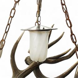 Deer antler chandelier, of triangular form, with four fitted lights H76cm