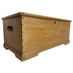 Victorian pine blanket box enclosed by hinged lid, fitted with wrought metal carrying handles, on skirted base