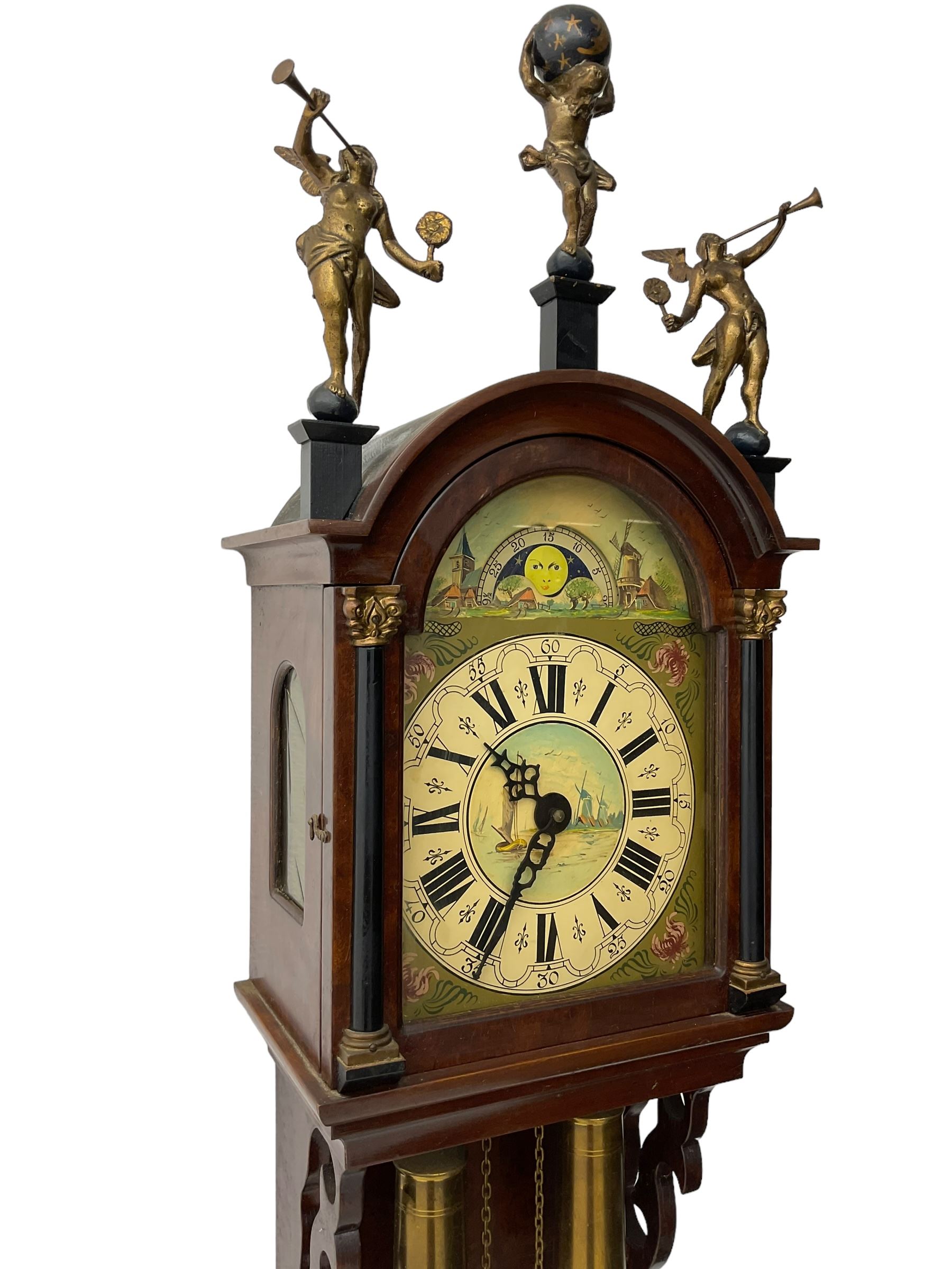 20th century weight driven Dutch WUBA wall clock -  with a break arch top and mounted gilt figures to the arch, painted dial with working moon disc, chapter ring with Roman numerals and pierced steel hands, twin train chain driven movement striking the hours on a bell. With pendulum and brass cased weights.