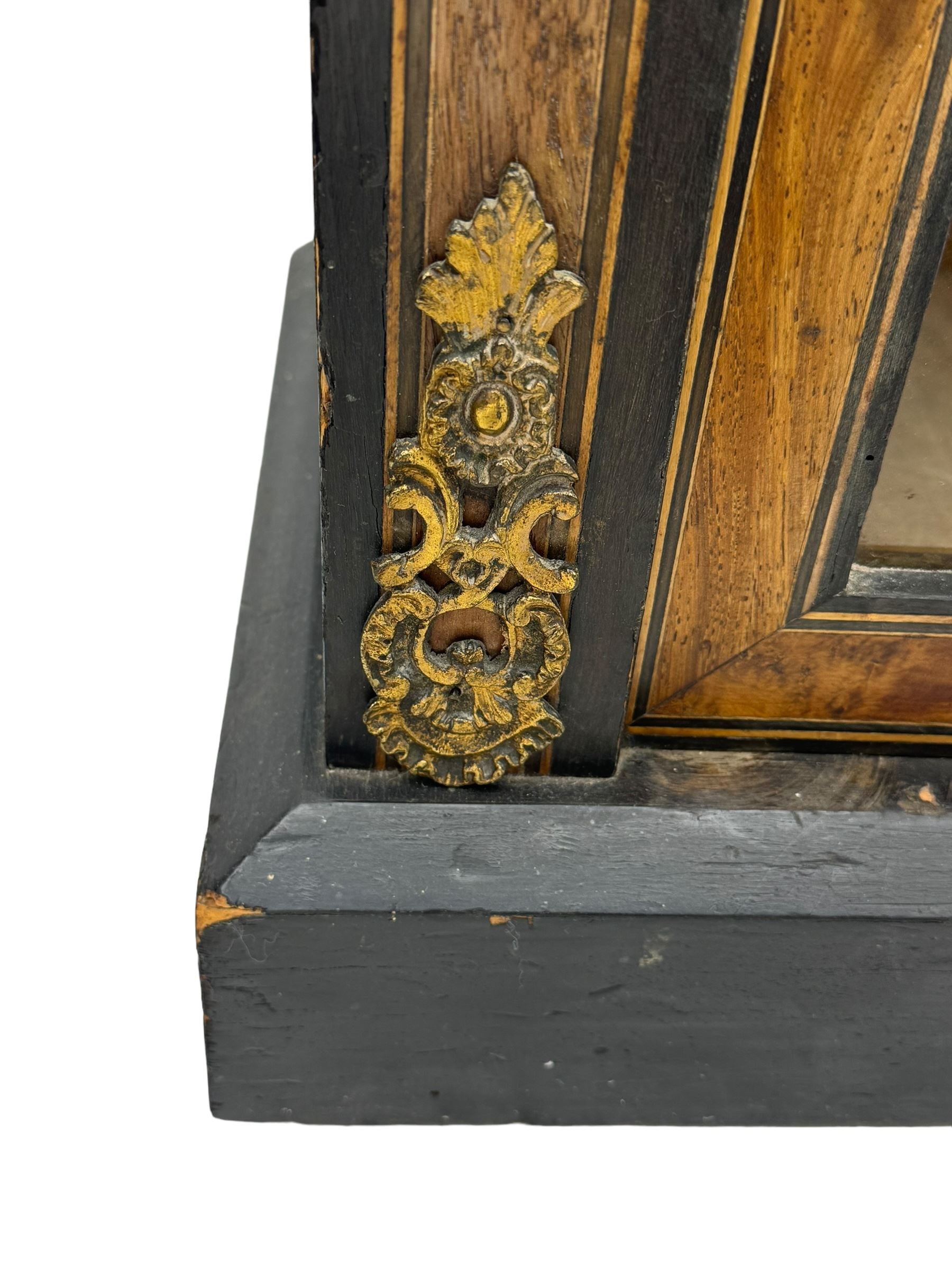 Victorian ebonised and walnut pier cabinet, rectangular top over figured frieze with central star motifs, enclosed by single glazed door, decorated with cast gilt metal mounts and beading, on chamfered plinth base 