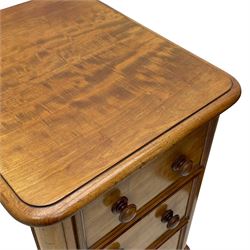 Pair of Victorian figured mahogany pedestal chests, rectangular form with rounded front corners, moulded top over three drawers with applied mouldings and turned handles, on moulded plinth base