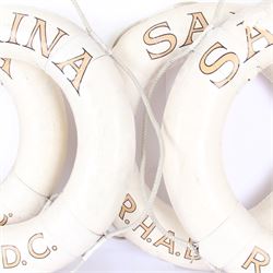 Four mid 20th century yacht lifebuoys, each painted in gold and black lettering 'Sarina R.H.A.D.C', upon a white ground, D68cm