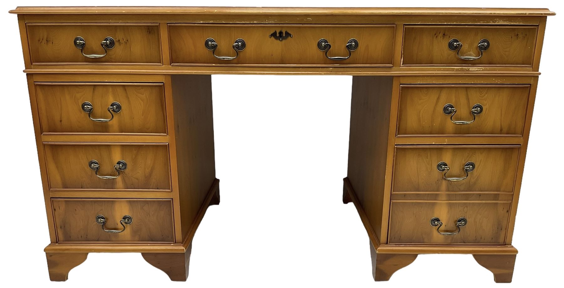 Georgian design yew wood twin pedestal desk, moulded rectangular top over nine cock-beaded drawers, on bracket feet