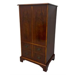 Wade - yew wood hi-fi cabinet, moulded rectangular hinged top over double-door cupboard with figured veneer, enclosing three adjustable shelves, lower section fitted with two cupboards to resemble four drawers, enclosing three drawers and open storage