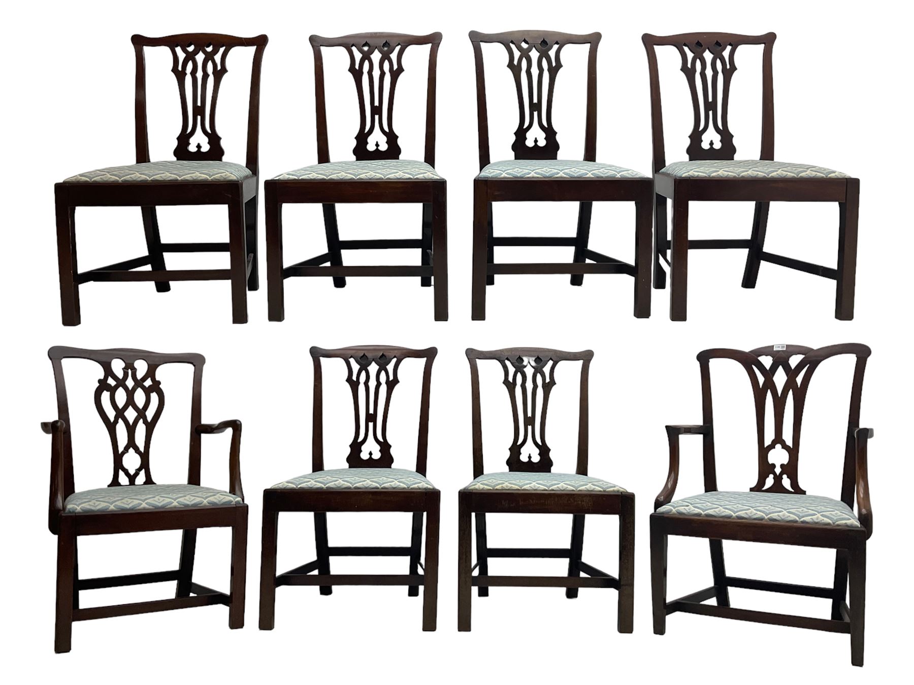 Set of eight (6+2) George III mahogany dining chairs, yoke cresting rail over shaped pierced splat back, drop in seats upholstered in pale blue patterned fabric, raised on square chamfered supports united by stretchers