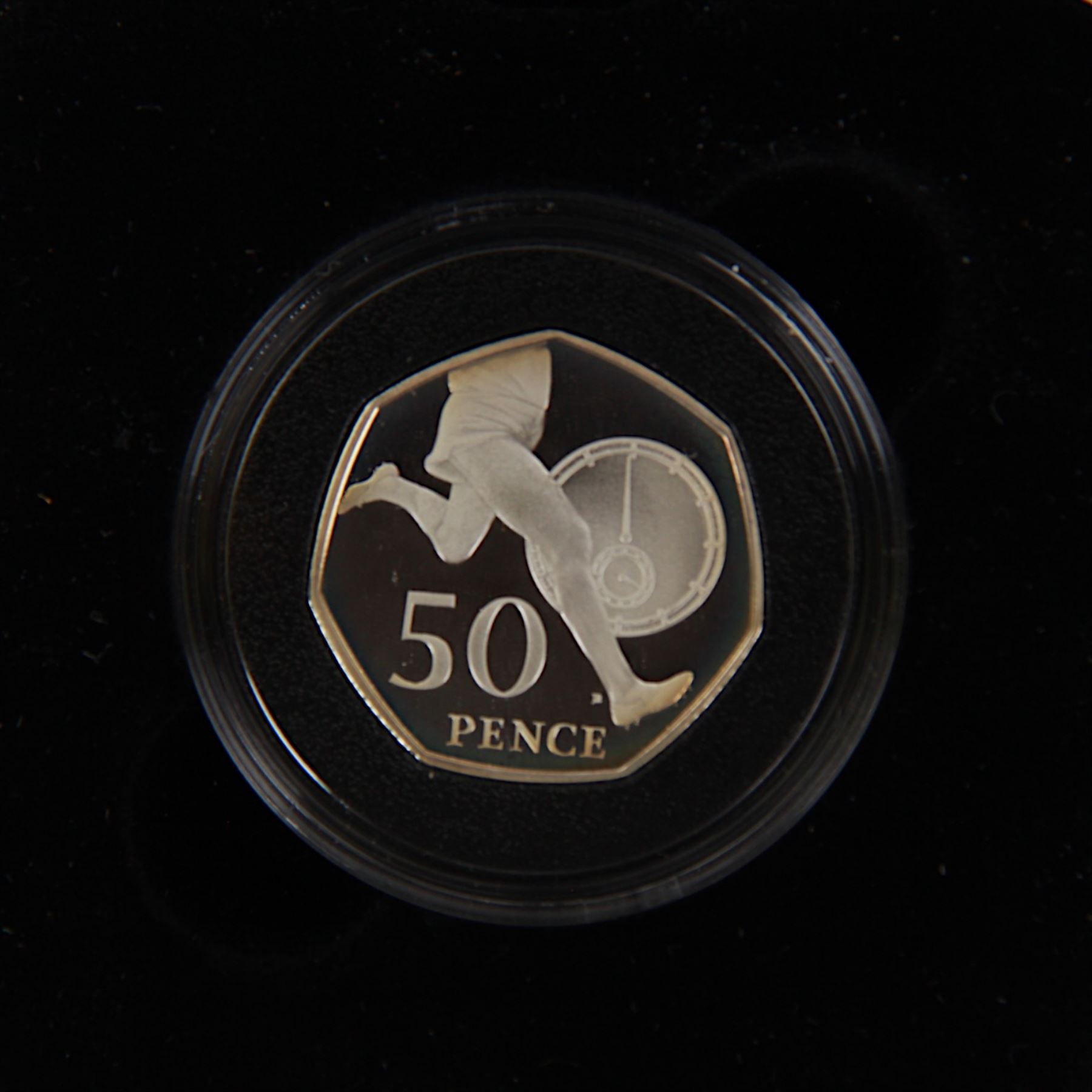 Seven The Royal Mint United Kingdom silver proof fifty pence coins, comprising 1994 'D-Day', 1997 piedfort, 2000 '150 Years of Public Libraries' piedfort, 2004 '50th Anniversary of the four-minute mile', 2004 '50th Anniversary of the four-minute mile' piedfort, 2005 'Celebrating the 250th Anniversary of Samuel Johnson's Dictionary' and 2005 'Celebrating the 250th Anniversary of Samuel Johnson's Dictionary' piedfort, all cased with certificates