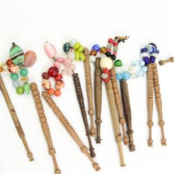 Collection of turned wooden lace maker's bobbins, including 19th century and later examples, mostly with glass spangles and turned shafts (100 approx)