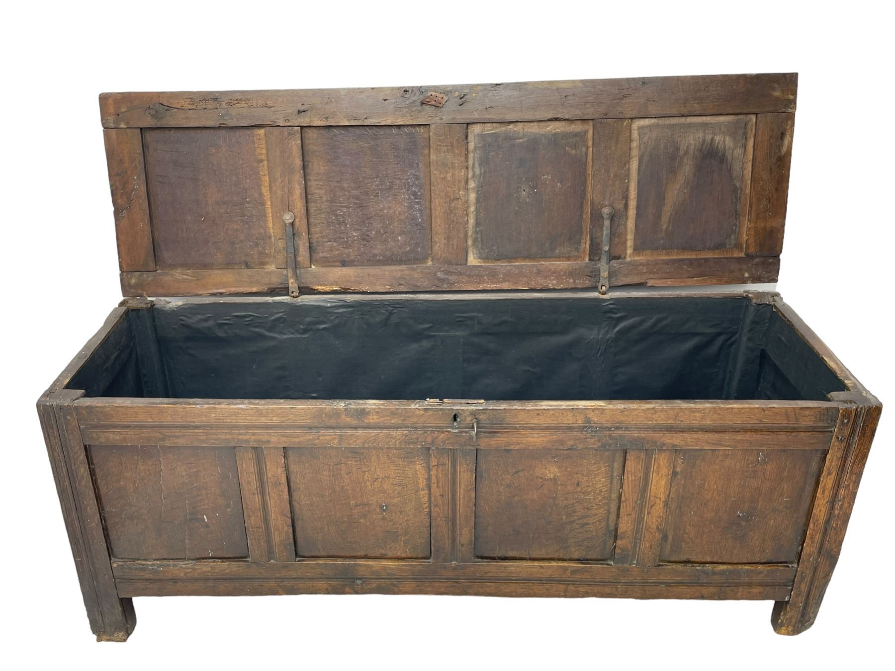 17th century panelled oak blanket chest or kist, quadruple panelled hinged lid over quadruple panelled front, moulded frame and pegged construction, on stile supports