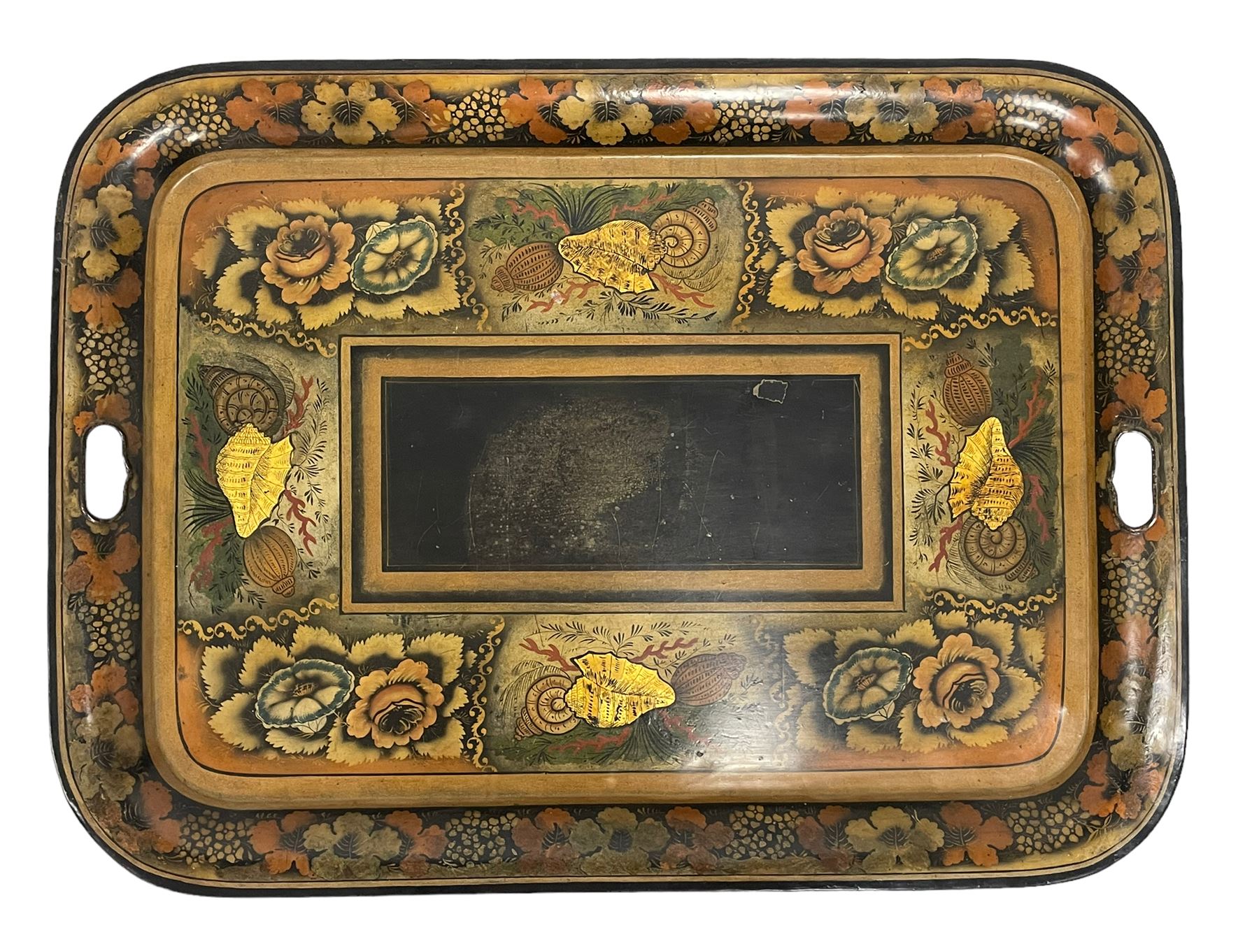 19th century tole ware tray of rectangular form, decorated with Japanese inspired floral motifs and gilt shells, with pierced handles, the associated ebonised and gilt stand, raised on ring turned splayed supports united by X-stretcher, decorated with gilt foliage