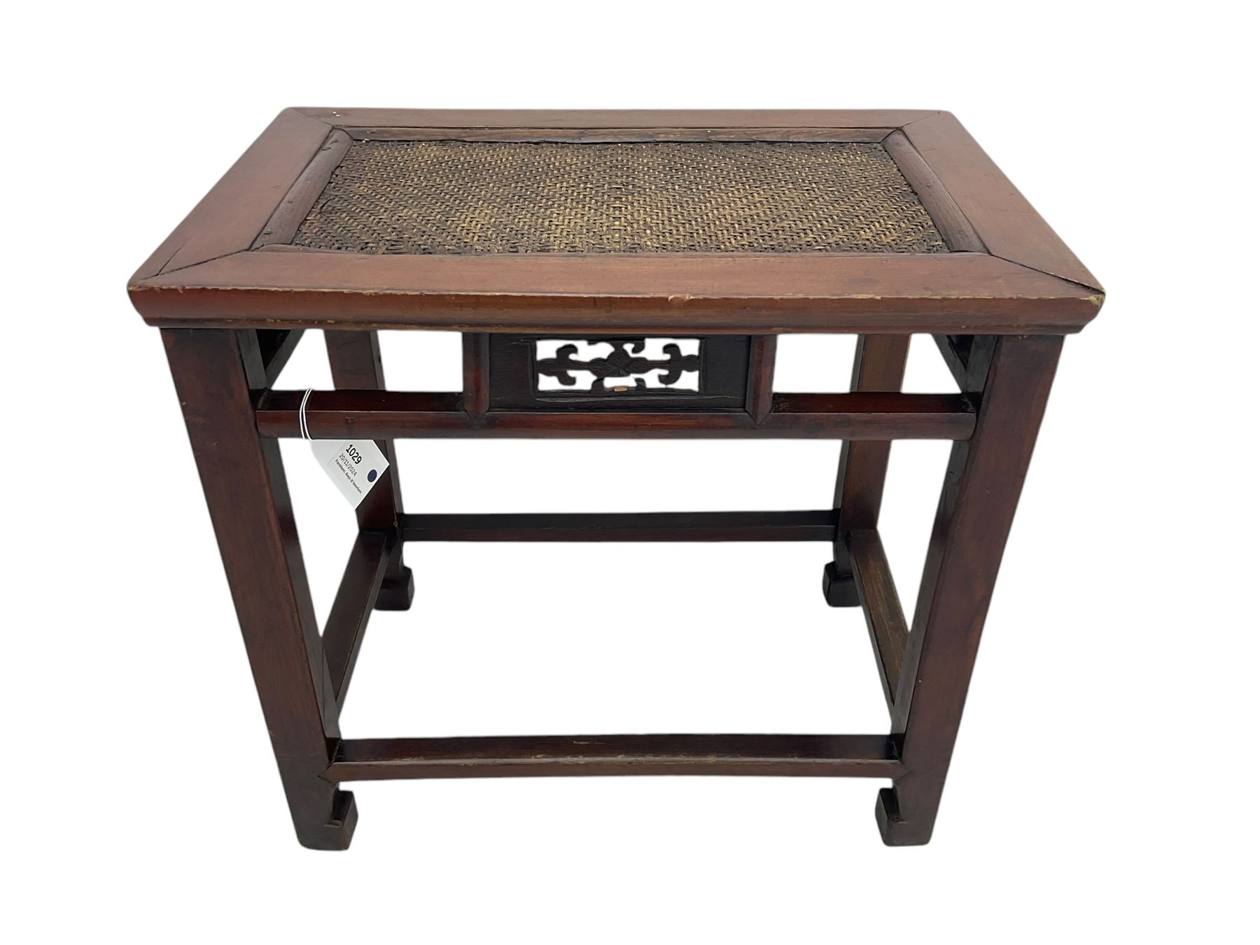 Pair of early 20th century Chinese hardwood side tables, each with rectangular woven cane top, pierced frieze with foliate motif, square supports joined by cross-stretchers