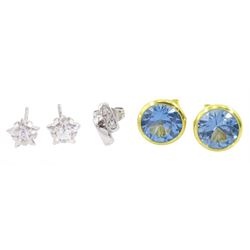 Pair of 14ct gold blue topaz stud earrings, pair of 9ct white gold cubic zirconia star stud earrings and a single 18ct white gold diamond earring