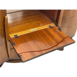 Beautility - mid-20th century walnut sideboard, fall-front with sliding top enclosing mirror interior, fitted with two drawers and flanking cupboards, on sledge feet with curved stretchers 