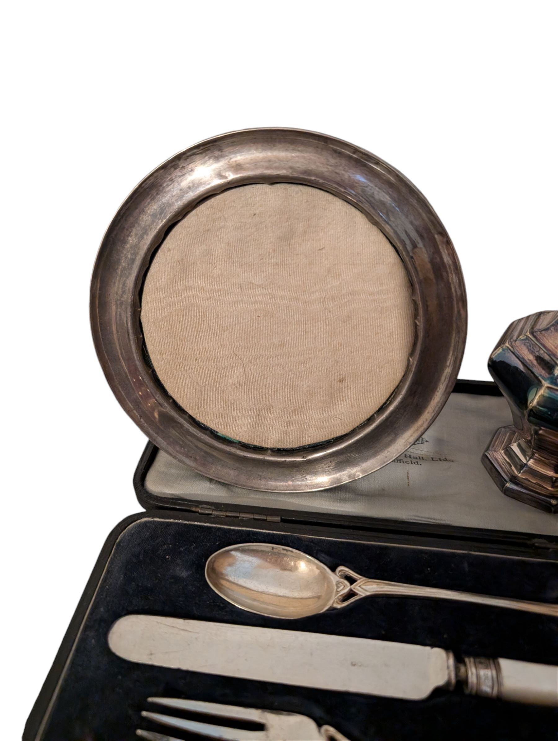 Silver photograph frame and a silver mustard spoon, both hallmarked, together with an Egyptian silver box, silver plated Walker & Hall christening set, silver plated sugar caster, silver plated coffee bean spoons, and silver plated pepper and salt shaker