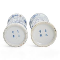 Pair of 19th century Chinese blue and white sleeve vases, each of cylindrical form with flared rim, painted with exotic birds amongst foliate sprays, four character Kangxi mark beneath, H21cm