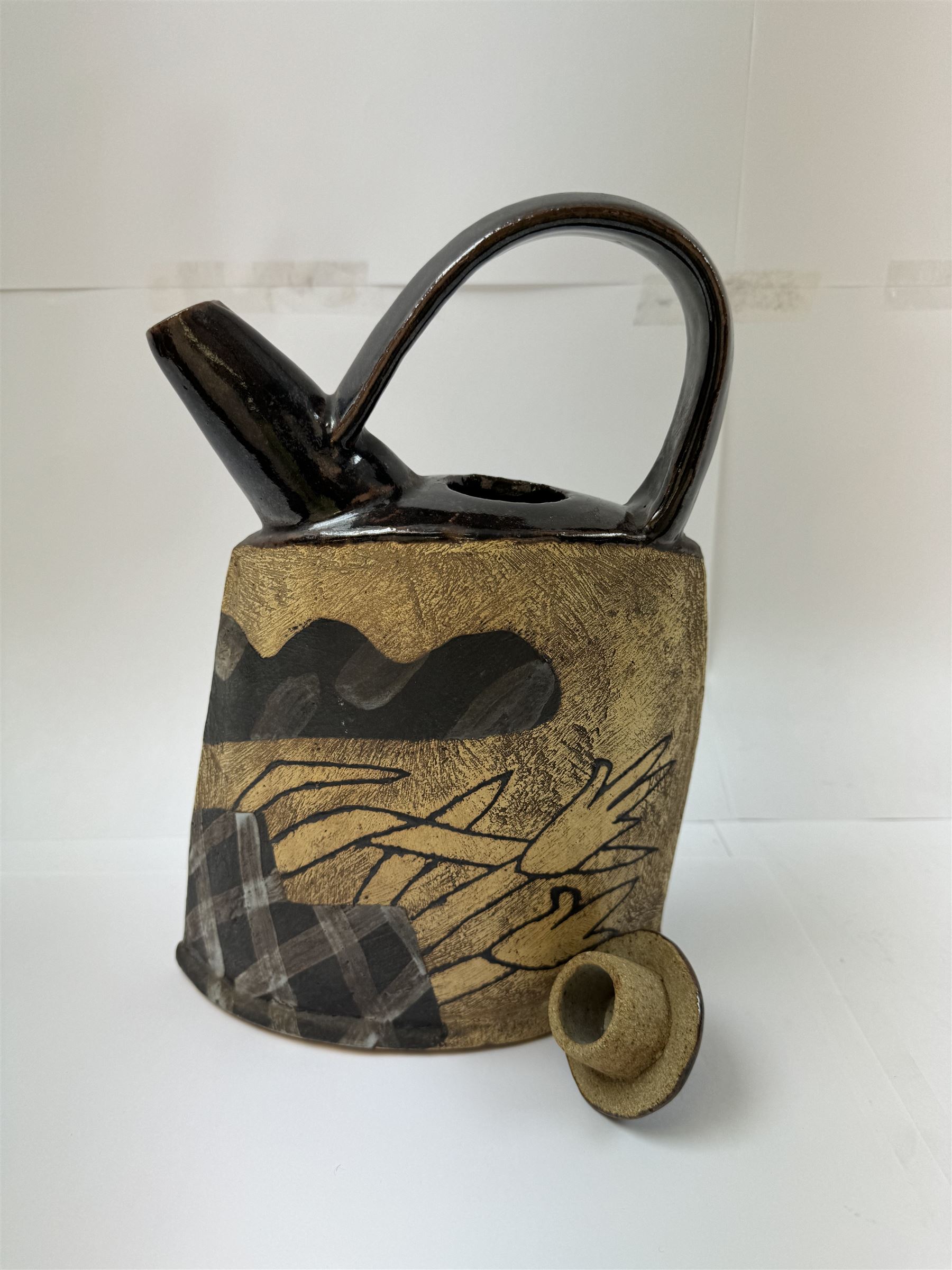 John Maltby (British 1936-2020): studio pottery teapot decorated with flowers, the spout and handle with tenmoku glaze, signed beneath, including handle H29cm