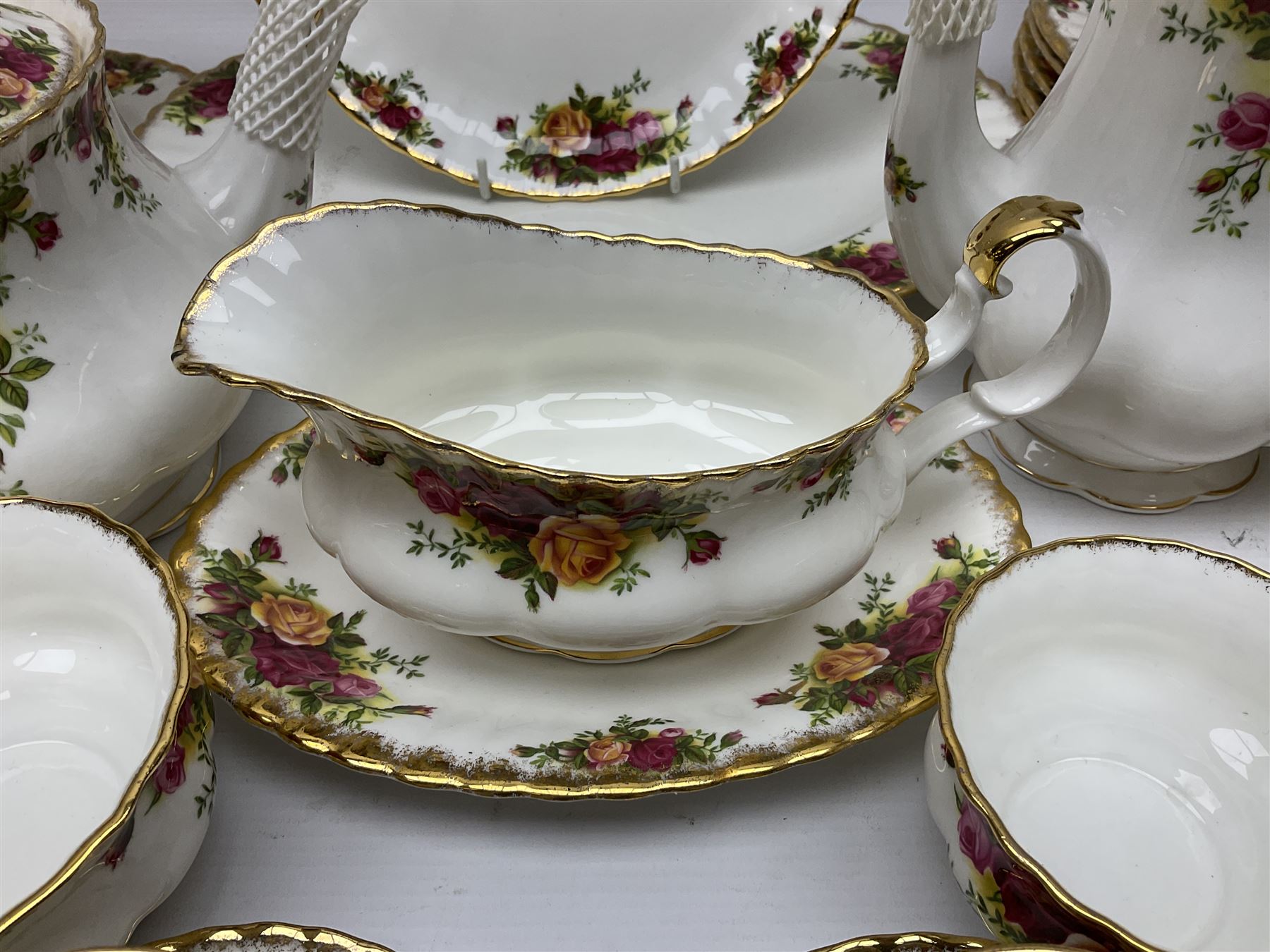 Royal Albert Old Country Roses pattern tea and dinner service, including teapot, coffee pot, two milk jugs, two open sucriers, six teacups and saucers, six dinner plates, six soup bowls, etc  