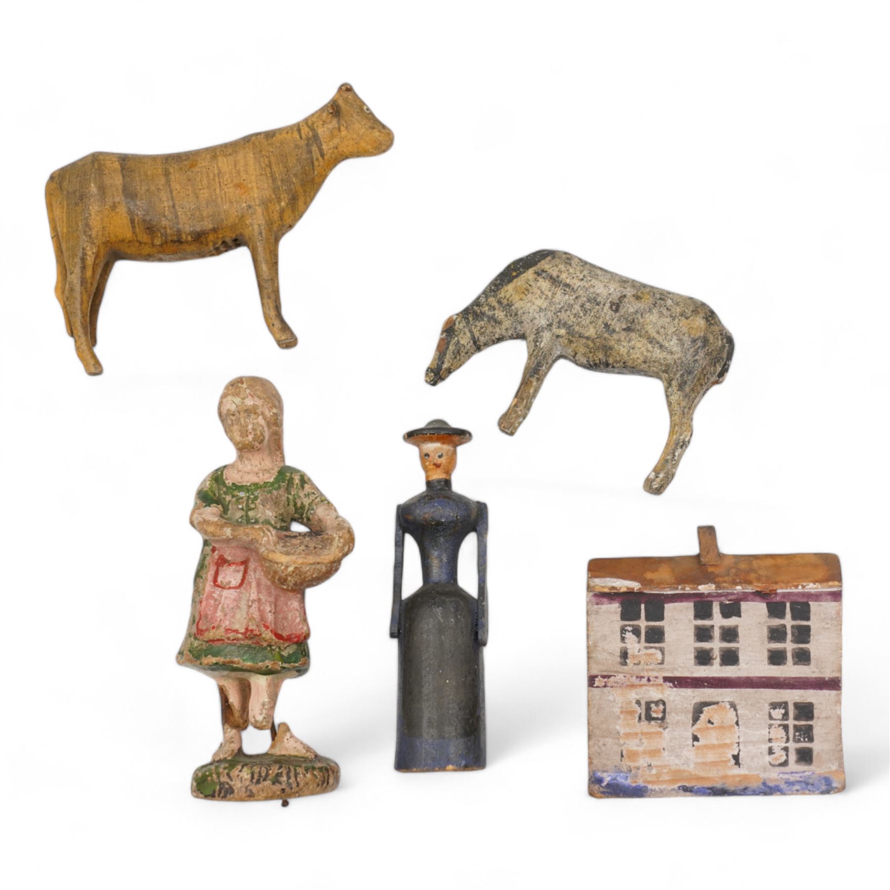 19th century German carved and painted figures including a female figure and two cows, probably from Erzgebirge Noah's Ark, a similar period carved and painted wooden house and an Elastolin figure (5)