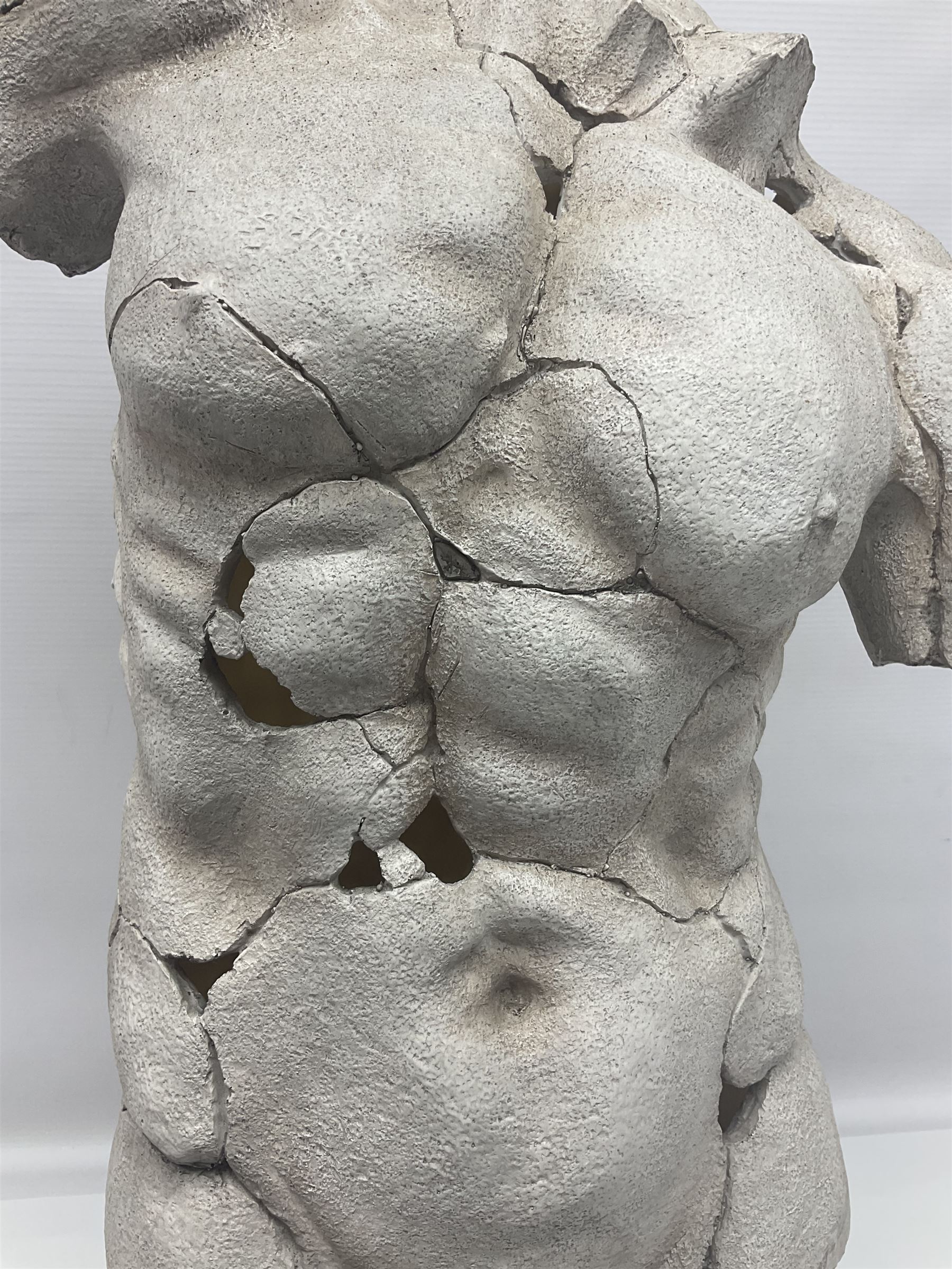 Composite sculpture of a Classical male torso on a stand, H65cm