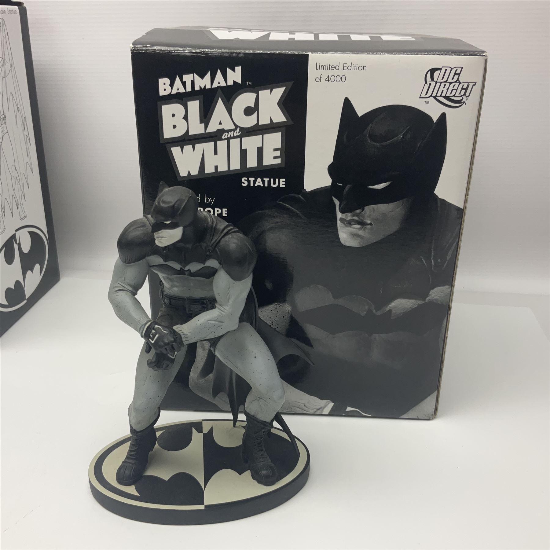 Group of five limited edition DC Direct Black and White Batman hand-painted cold-cast porcelain statues in original boxes, with two similar examples from DC Collectibles 