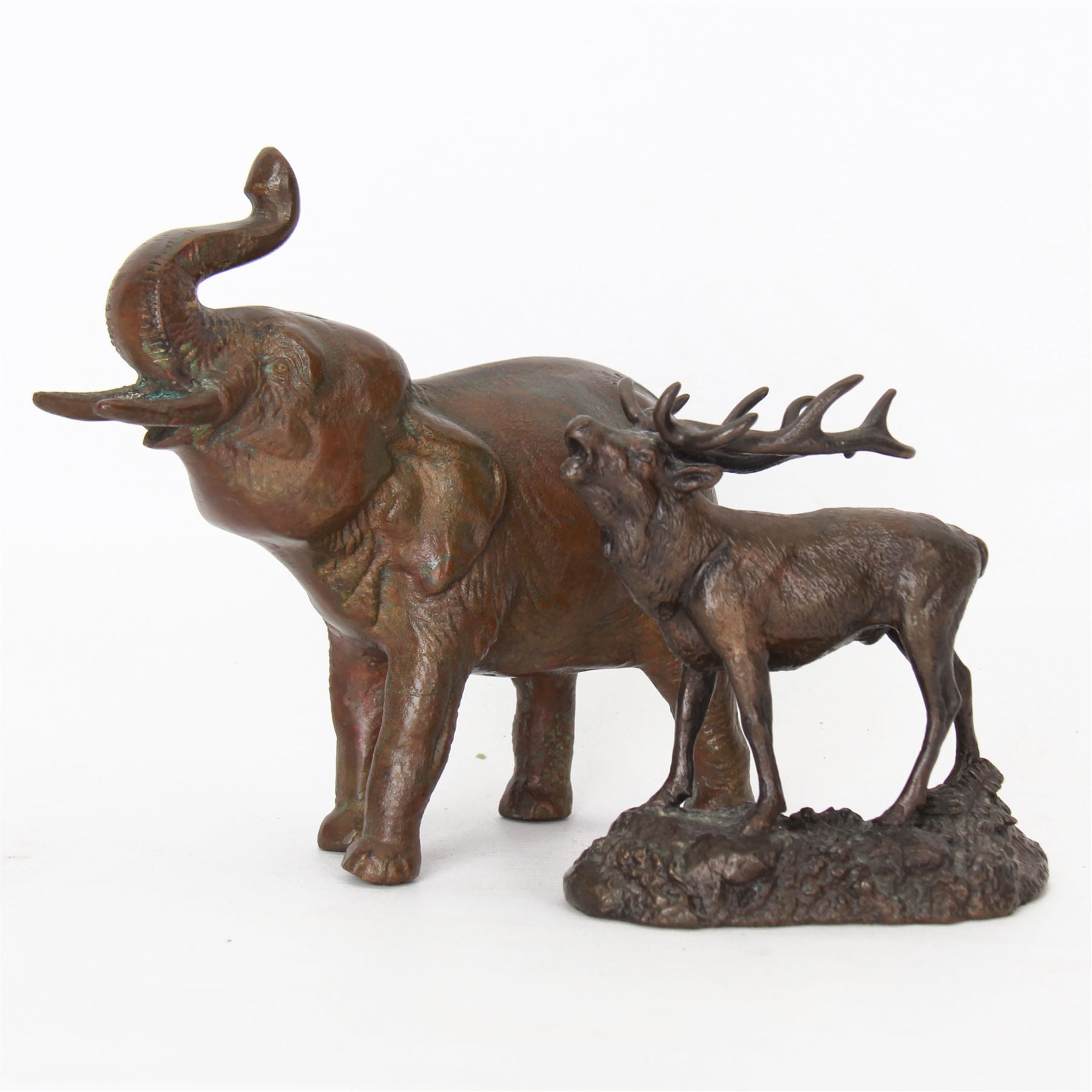 Two bronzed animal figures, the first modelled as an Indian elephant, H16cm, the second as a stag, H11cm