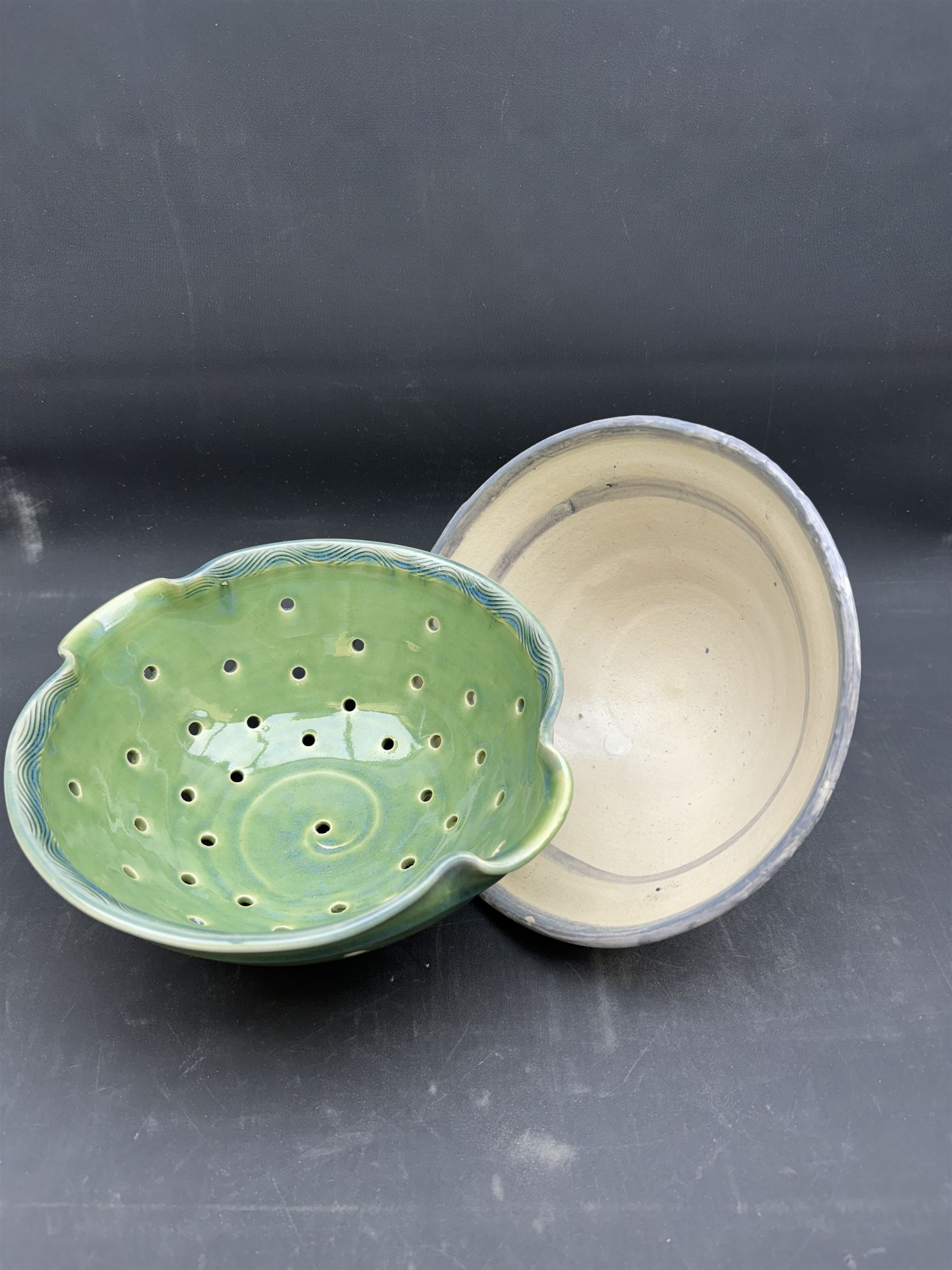 Studio pottery bowl of conical form, with blue band to the rim, together with Arwyn Jones dish, D20cm